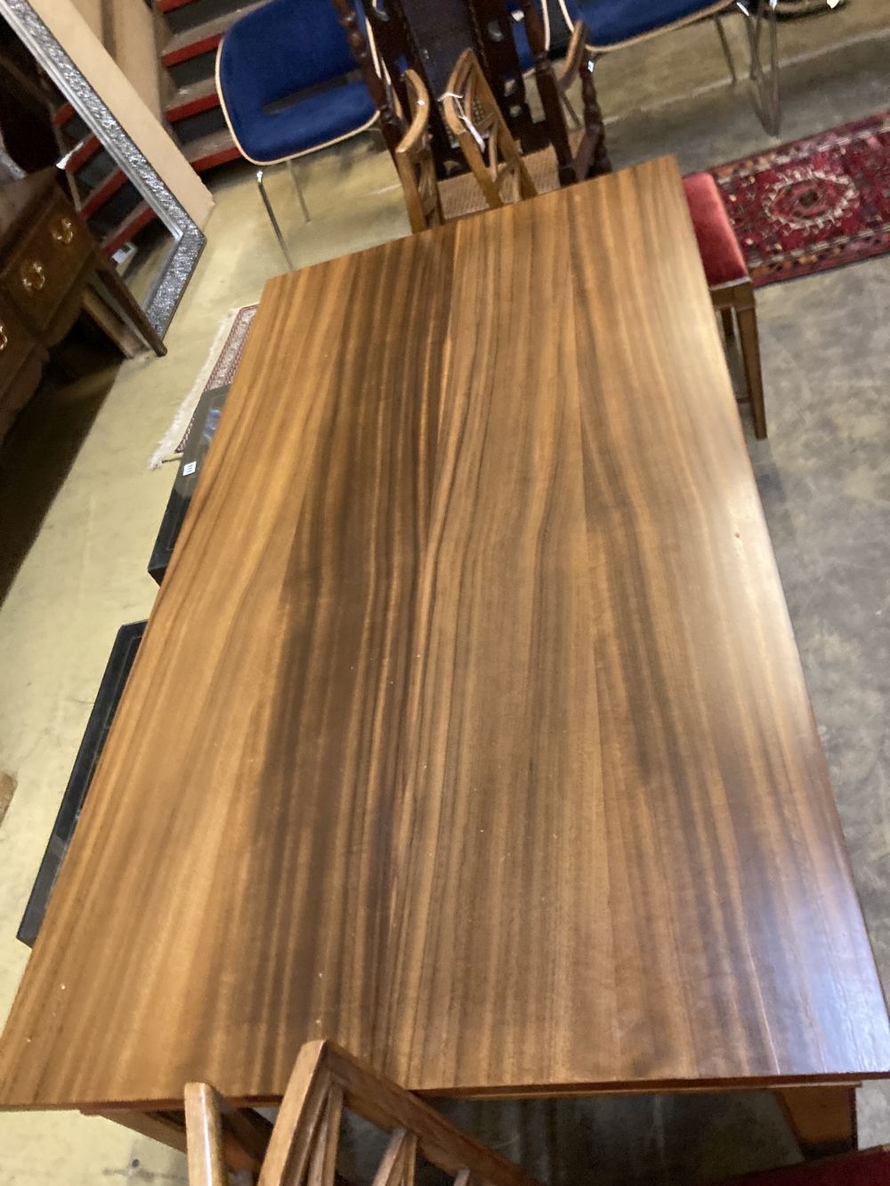 A Swedish dining table and four chairs, table 270cm extended (two spare leaves) width 80cm height 74cm